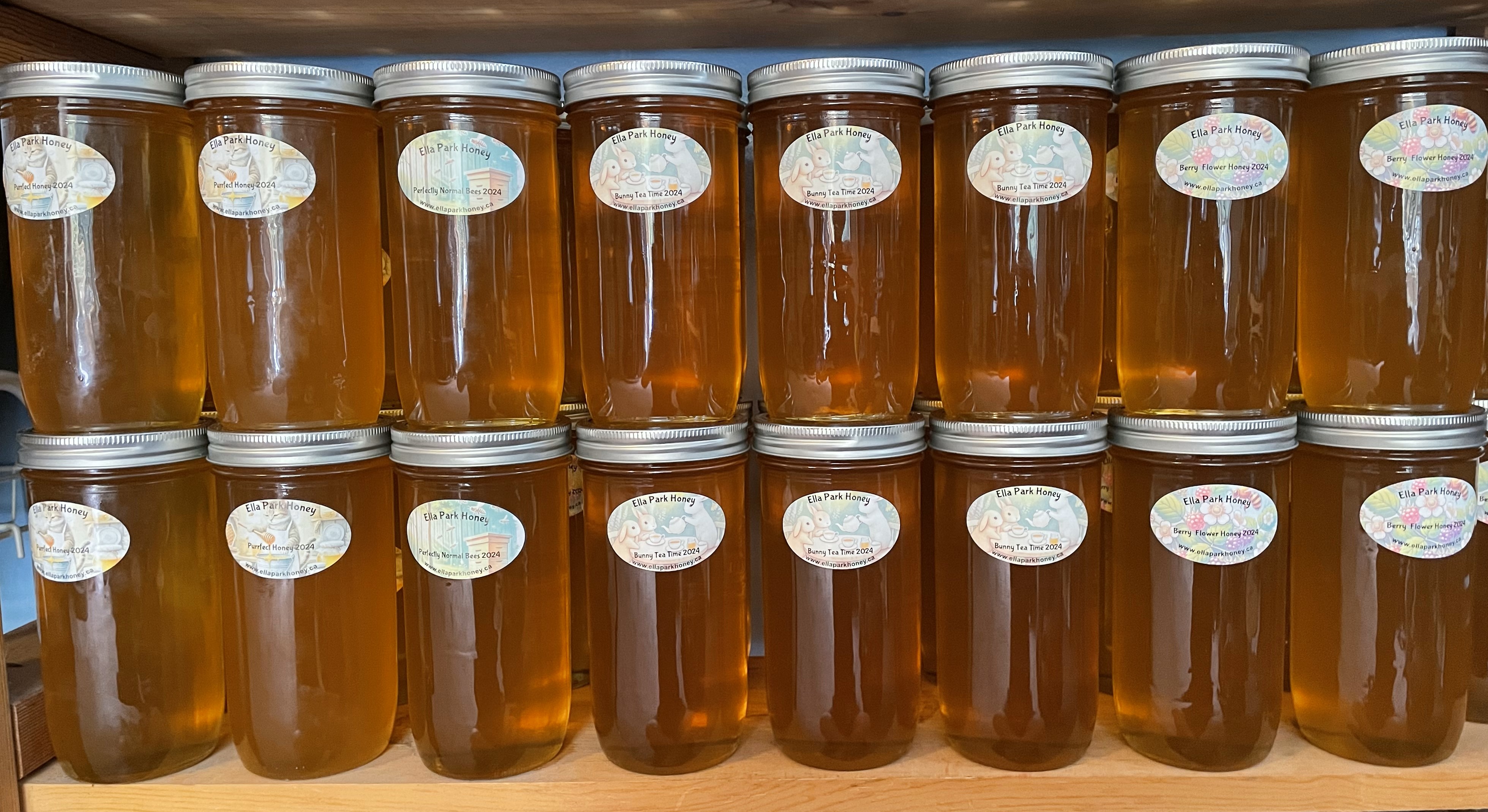 Jars of honey neatly arranged on a shelf